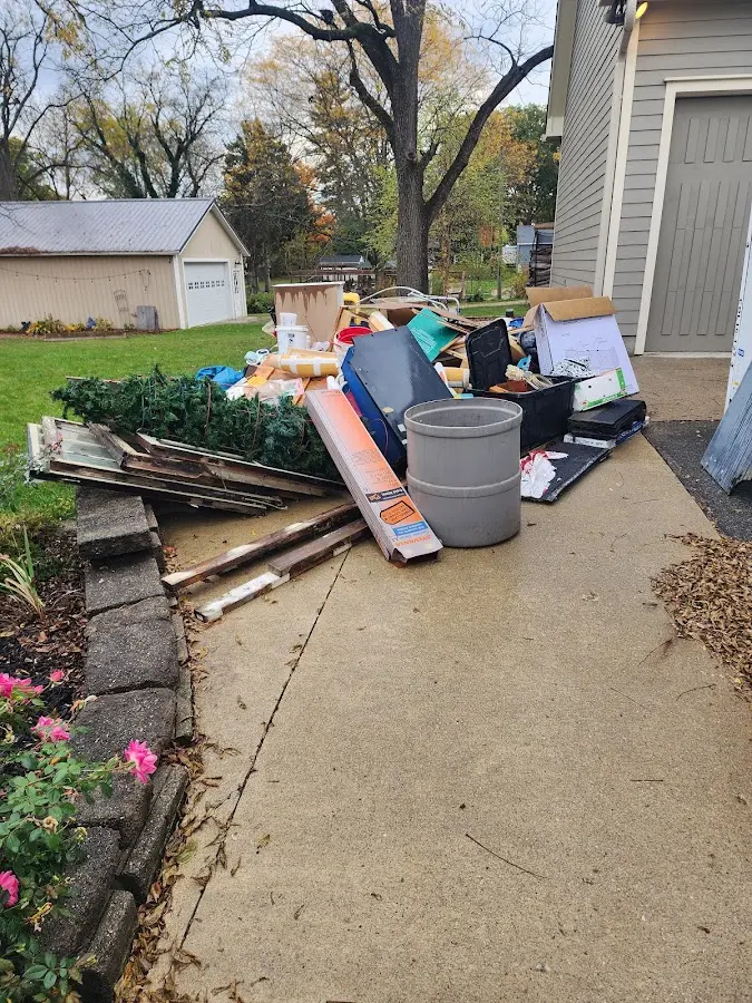 Dumpster being loaded with debris for Estate Cleanout Dumpster Rental in Westerlo